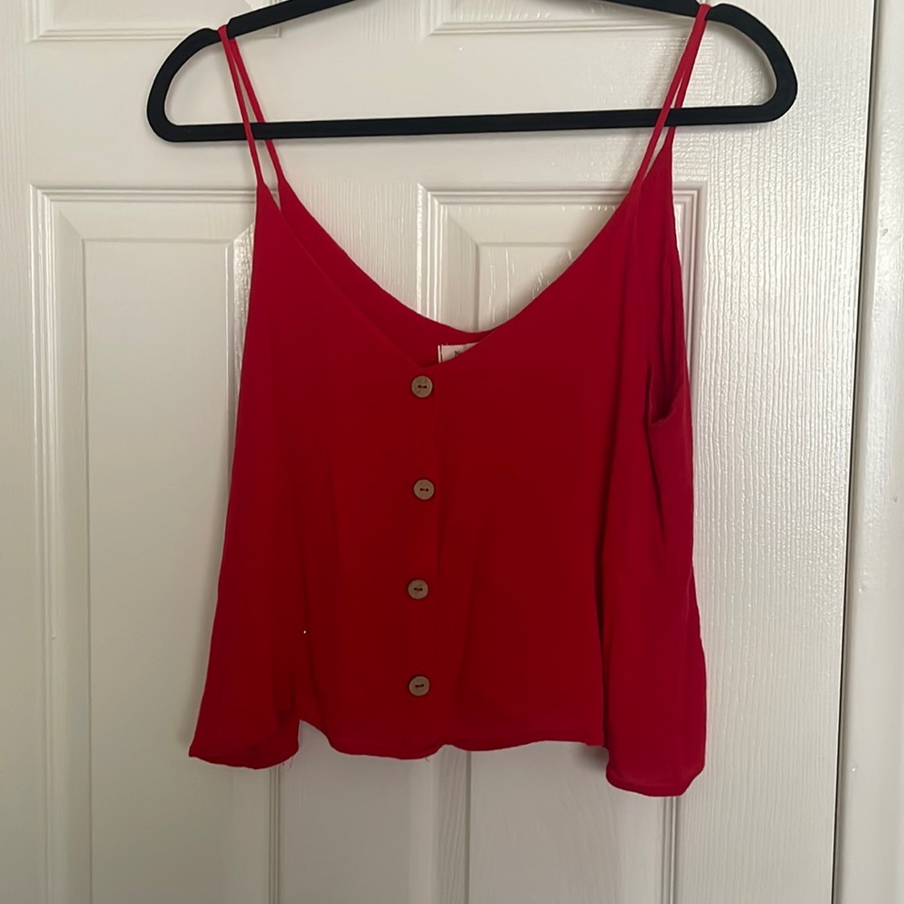 Red spaghetti strap shirt.